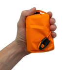 Nödsovsäck med nödvisselpipa